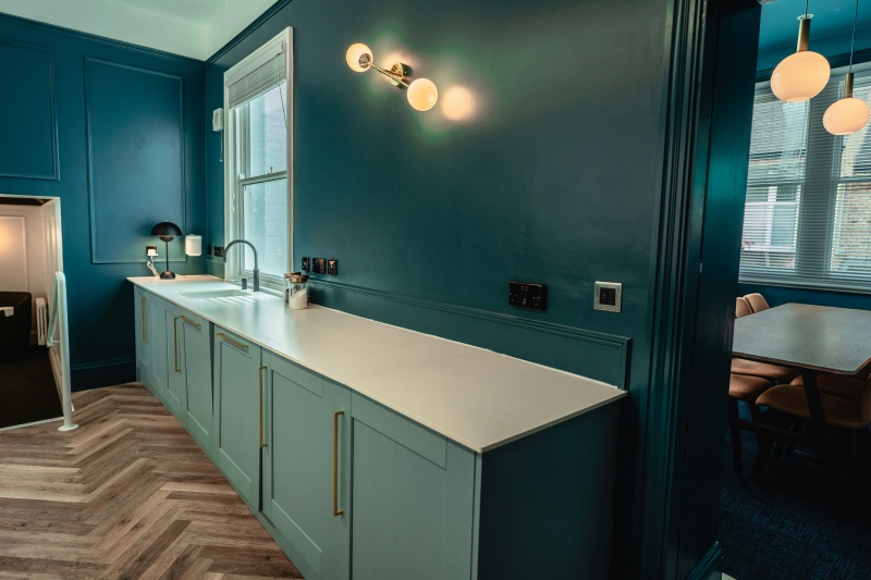 Blue cabinetry with sleek finish