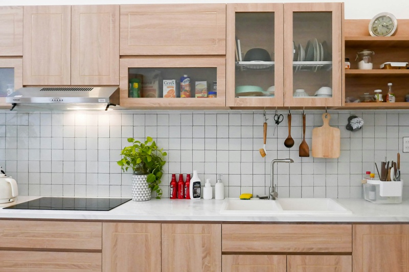 Custom built light wood kitchen cupboards
