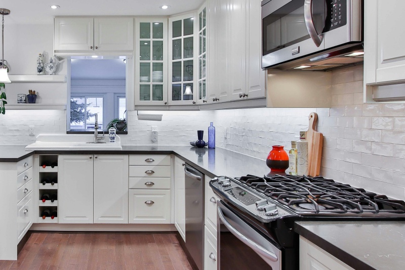 Custom white cabinetry with wine display