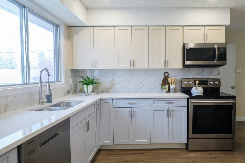 Utilizing statement light fixtures above cabinets