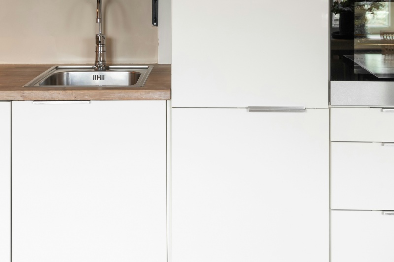 Contemporary tab edge pull cabinets