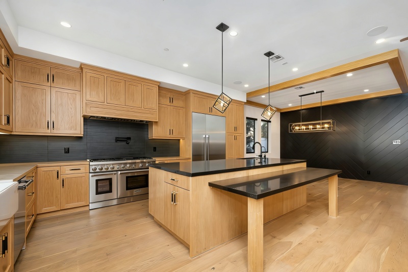 Wood cabinets add warmth to black countertops Wood cabinets add warmth to black countertops